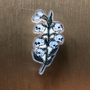 Lily of the valley skulls acrylic pin